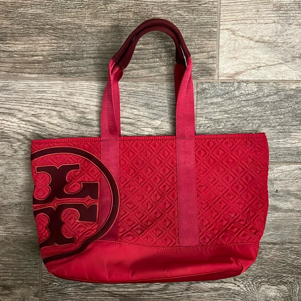 Tory Burch Medium Sized Zippered Tote in a Raspberry Red/Maroon Color